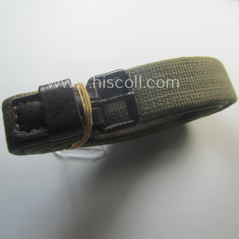 'Standard-issue'-pattern, WH trousers'-belt (or: 'Riemen für Hosen') as was executed in a combination of woven, field-grey-coloured linnen and/or brownish/black-coloured leather