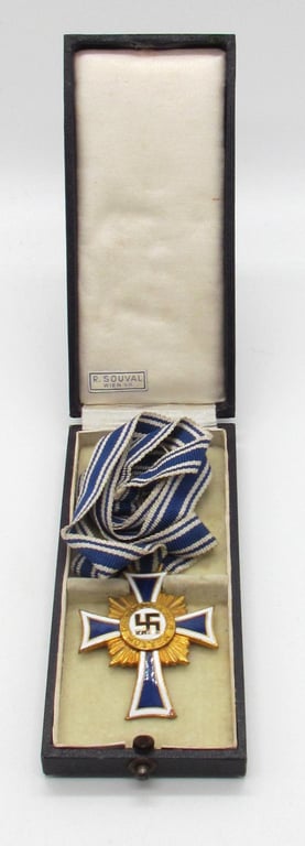 Mother’s cross in gold with box ( R. Souval )