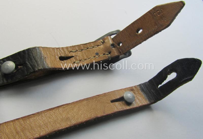Later-war-period- and 'standard-issue'-pattern, black-coloured- and/or leather-based WH helmet-strap (ie. 'Riemen für Stahlhelm') being an: 'HCH 4'-marked example that comes in a never mounted ie. 'virtually mint' condition