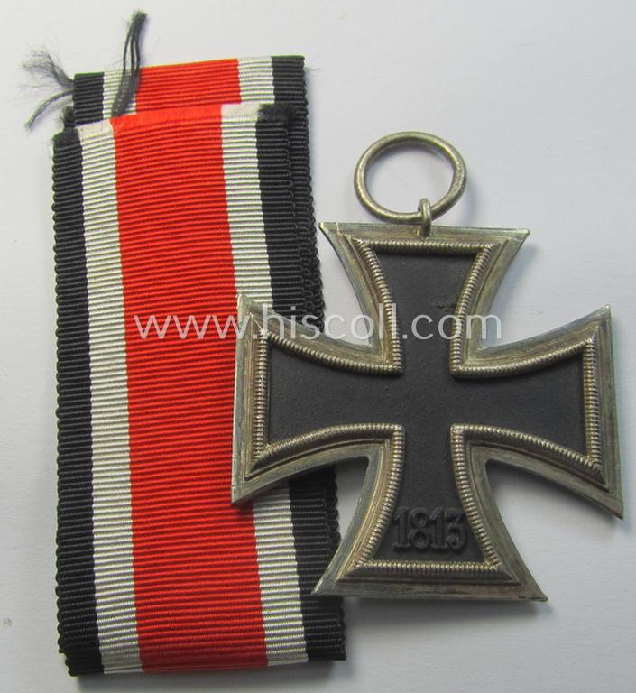 'Eisernes Kreuz II. Klasse' being a non-maker-marked example that comes together with its original- and once-mounted ribbon (ie. 'Bandabschnitt') as was produced by a (by me) unidentified maker (ie. 'Hersteller')