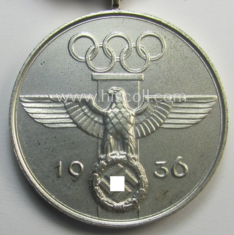 Superb, 'Deutsche Olympia-Erinnerungsmedaille 1936' being a non-maker-marked example that comes mounted onto its original ribbon (ie. 'Bandabschnitt') and that comes stored in its typical, beige-white-coloured etui