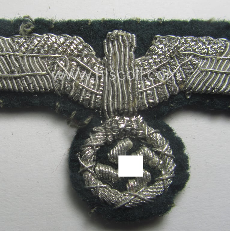 Clearly used- and/or cap-removed, WH (Heeres) officers'-pattern, visor-cap eagle (ie. 'Mützenadler für Schirmmütze') being a hand-embroidered example that comes mounted onto a darker-green-coloured- and/or woolen-based background