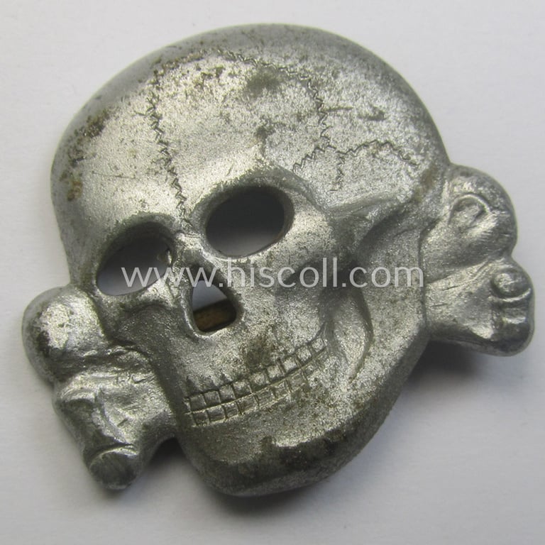Superb - albeit regrettably parly incomplete but nevertheless rarely encountered! - 'Waffen-SS' visor-cap skull (ie. 'Totenkopf für Schirmmütze') being a detailed- and/or maker- (ie. 'RzM M1/24'-) marked example