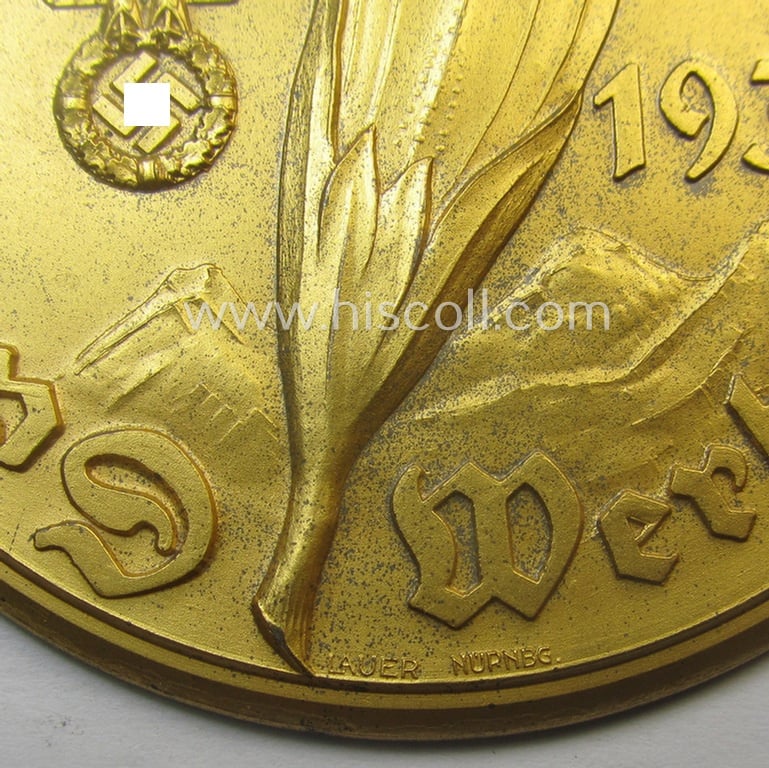 Commemorative N.S.K.K.-related plaque (ie. 'Erinnerungs- o. nichttragbare Teilnehmerplakette') showing a flower, typical N.S.K.K.-eagle-device and text: 'Salzkammergut Wertungsfahrt 1939'
