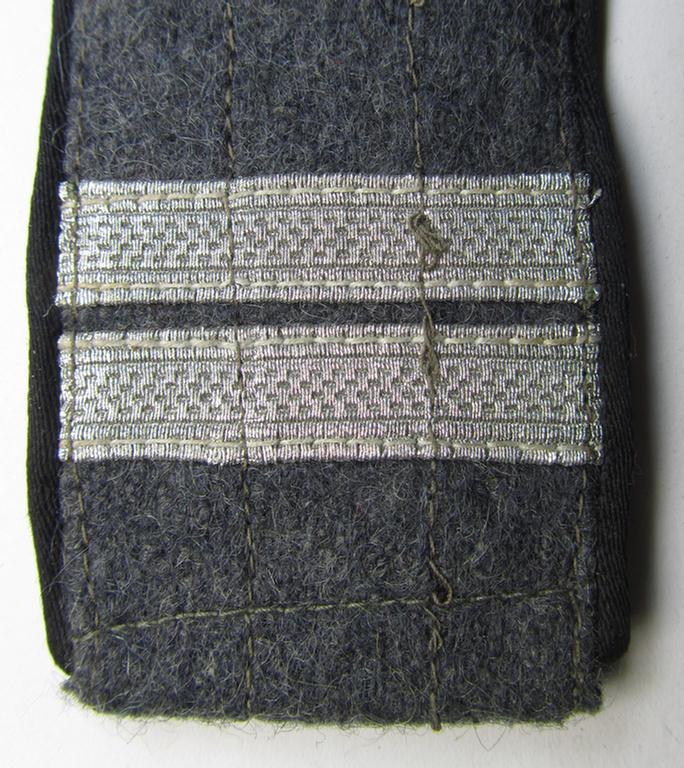 Single - but nevertheless scarcely seen! - 'Ostvölker'-related, 'Luftwaffe'-type shoulderstrap showing the black-coloured piping (and having a pair of horizontally-mounted rank-stripes 'off-factory'-attached)