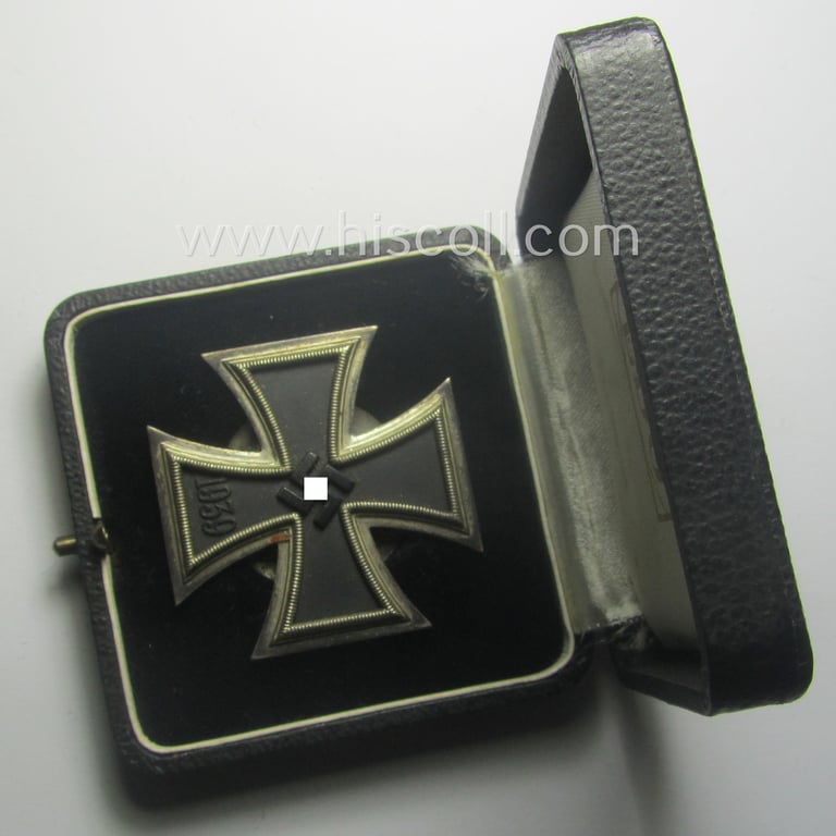 Stunning, 'EK 1. Klasse' (or: Iron Cross 1st class) as executed in the scarcely seen so-called: 'screw-back'-pattern being a maker- (ie. 'L/11'-) marked example that comes stored in its accompanying (and equally marked!) etui as issued