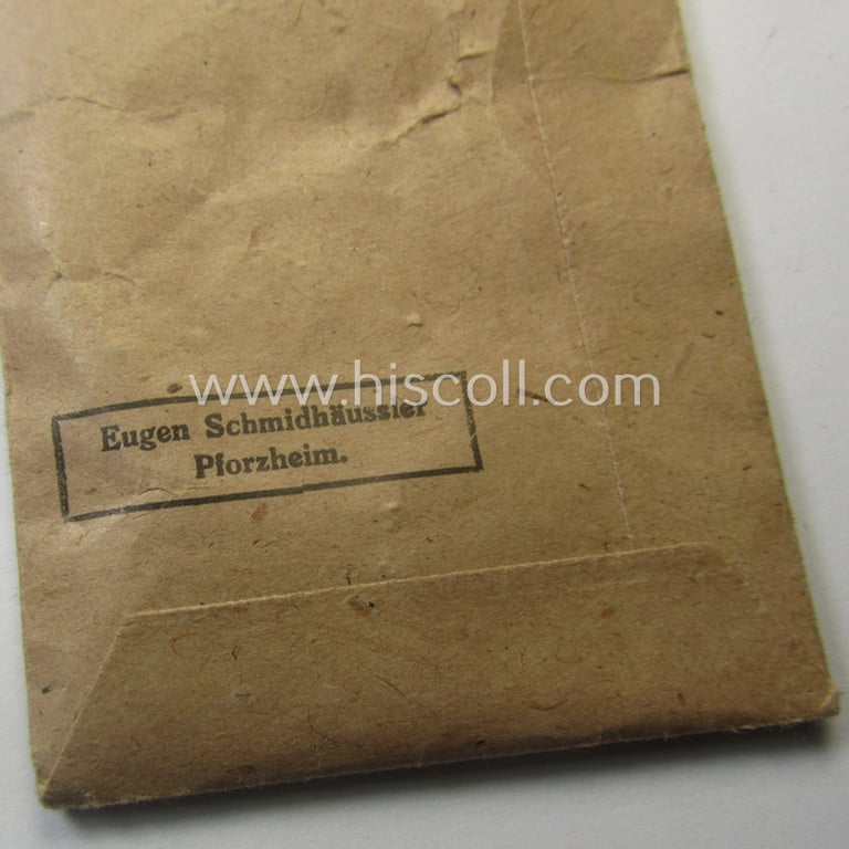 WH Czech-occupation- (ie. 'Anschluss'-) medal: '1. Oktober 1938' that comes with its accompaning 'PB-Spange' and that comes stored in its period pouch by the maker: 'Eugen Schmidhäussler - Pforzheim'