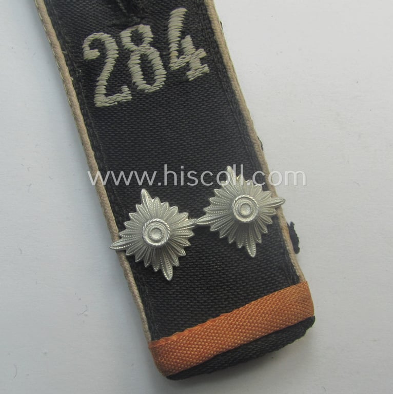 Single - and scarcely found! - white-piped, so-called: 'Reiter-HJ' (ie. 'HJ-Streifendienst') shoulderstrap as was intended for usage by a: 'HJ-Oberscharführer' as attached to the: 'Bann 284' (= 'Bann Uelzen-Daunenberg' in the 'Gebiet Nord Nordsee')