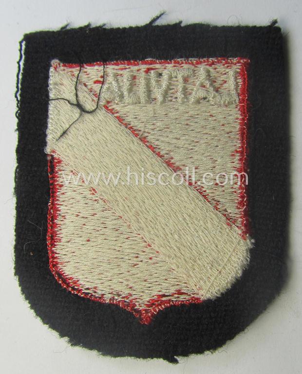Waffen-SS 'volunteer'-arm-shield as was intended for usage by soldiers of the: '15. o. 19. Waffen-Grenadier-Division der SS' (ie. 'lettische nr. 1 o. 2') and that comes in a 'virtually mint- ie. unissued', condition