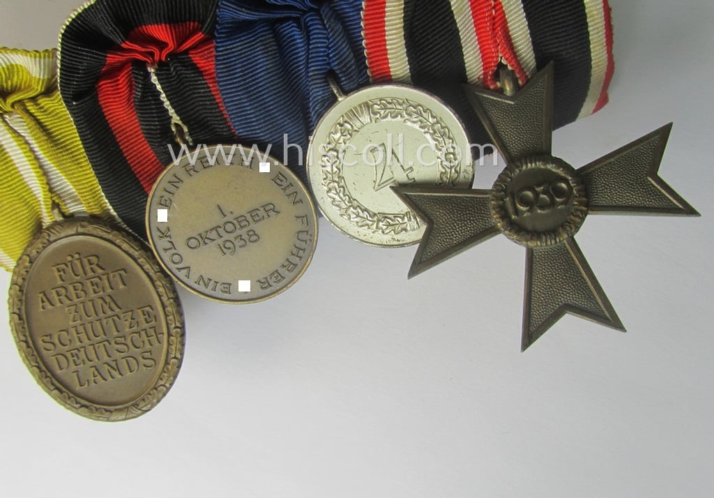 4-pieced, WH (Heeres, LW, etc.) medal-bar (ie. 'Ordenspange') showing a: 'KvK II.Kl. ohne Schw.', a: WH so-called: 'DA für 4 Jahre t. Dienste', a: WH Czech 'Anschluss'-medal: '1. Oktober 1938' and a: 'Westwall'-medal