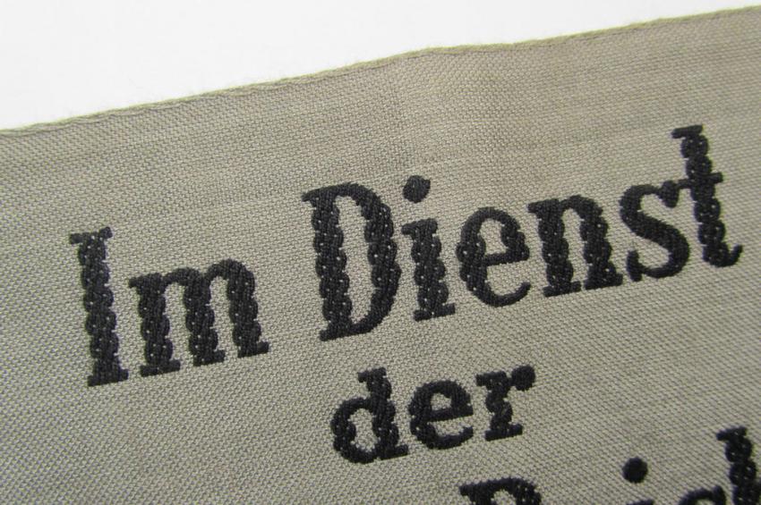 Attractive - and scarcely seen! - example of a DRB- (ie. 'Deutsche Reichsbahn'-) related armband entitled: 'Im Dienst der Deutschen Reichsbahn', being of the 'entirely-woven'-type in a technique similar to the 'BeVo'-weave pattern