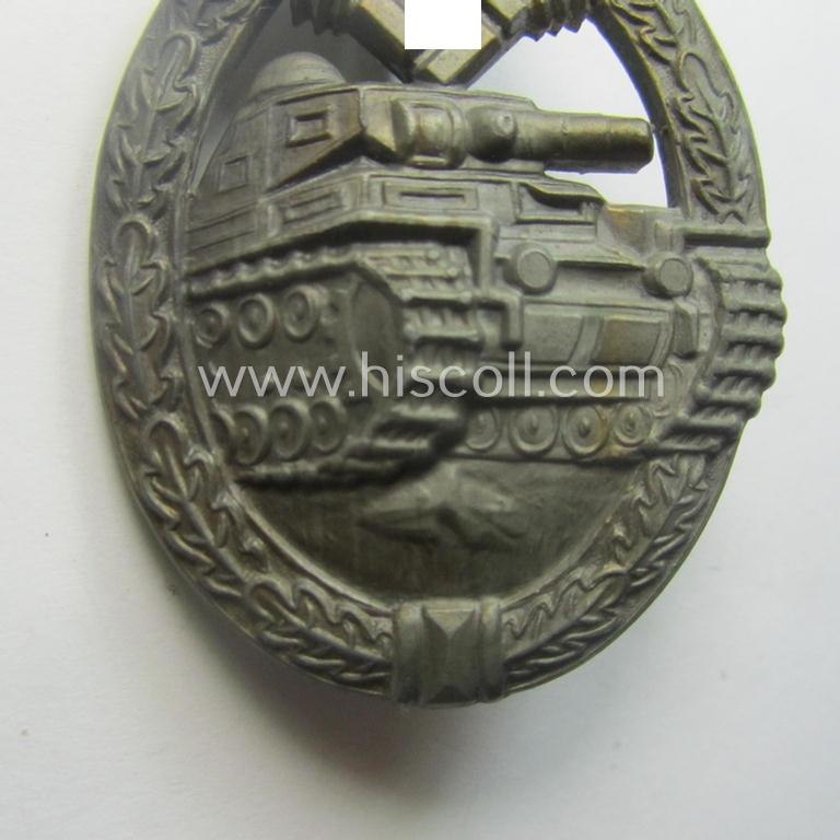 'Panzerkampfabzeichen in Bronze' (or: bronze-class panzer assault-badge or PAB) being a neat (I deem) somewhat later-war-period zinc- (ie. 'Feinzink'-) version as was procuced by the: 'Frank u. Reif'-company
