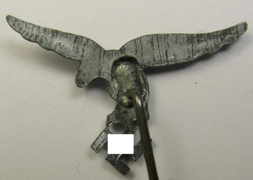 Greyish-silver-toned lapel-pin (ie. 'Zivilabzeichen') to be worn on the civil attire as was intended for usage by the various staff-members of the 'Luftwaffe' (depicting an early-pattern- ie. 'down-tailed'-eagle)