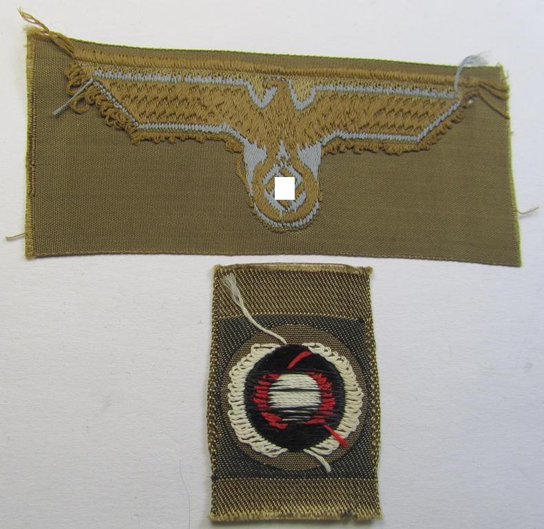 Superb - and rarely encountered! - WH (Heeres ie. 'tropical-issue'-) cap-eagle and cocarde-set (being a 'virtually mint- ie. unissued' set as executed in bluish-grey-coloured linnen on a tan-brownish-coloured background)