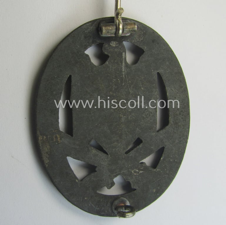 'Allgemeines Sturmabzeichen' (or: General Assault Badge ie. GAB) being a typical unmarked, zinc-based- (ie. 'Feinzink'-) and/or: 'flat-back'-version as was (I deem) produced by the: 'Rudolf Karneth'-company