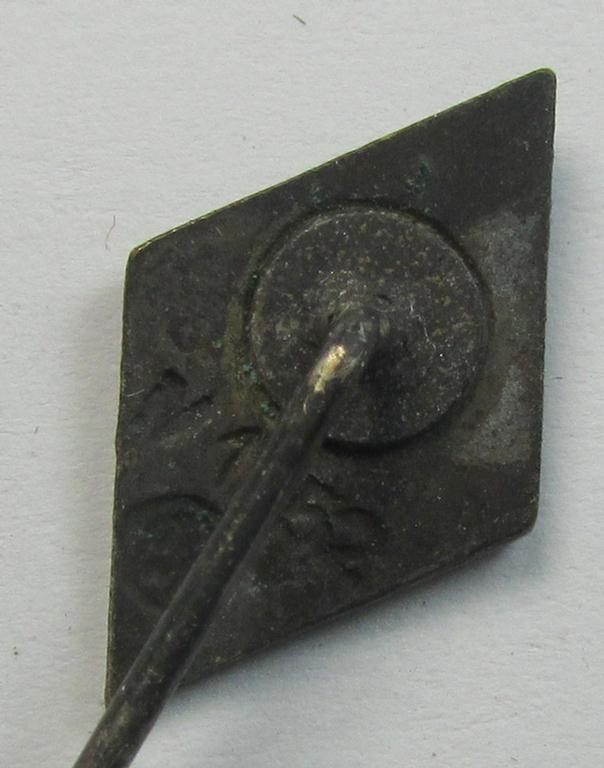 Attractive, 'NS-Studentenbund' enamelled lapel-pin (ie.: 'Raute') being a bright-red-, black- and white-coloured- and/or detailed example showing a clear maker- (ie. 'RzM M1/52'-) designation on its back