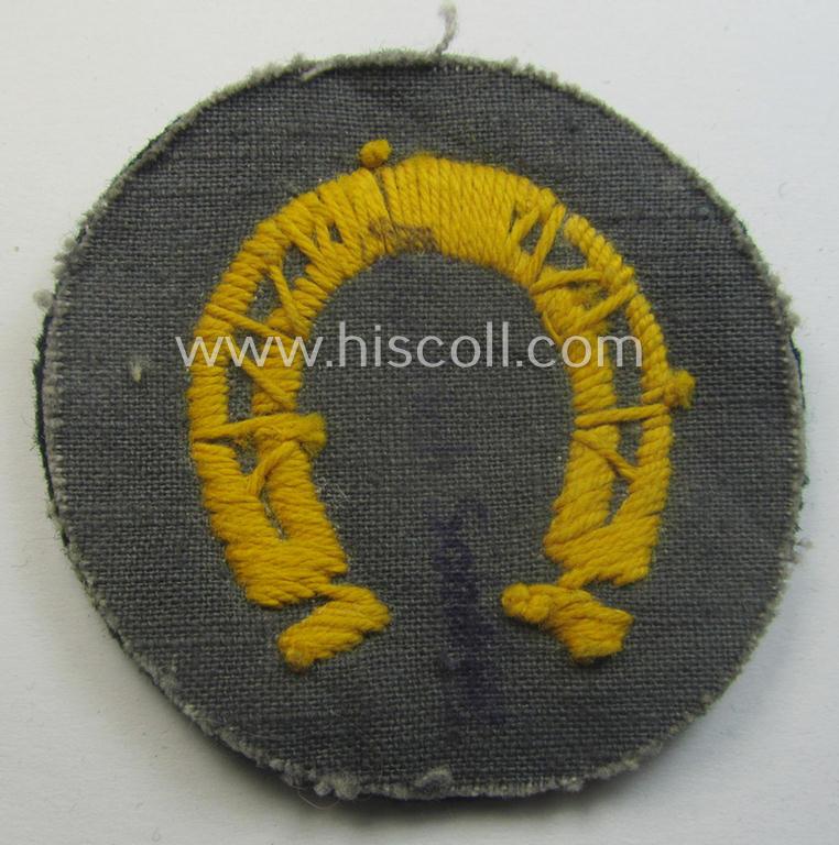 WH (Heeres) so-called: trade- and/or special-career arm-insignia (ie. 'Laufbahn- o. Tätigkeitsabzeichen') as was specifically intended for an army: 'Hufbeschlagmeister' (or farrier) being a neatly hand-embroidered variant on darker-green-coloured...
