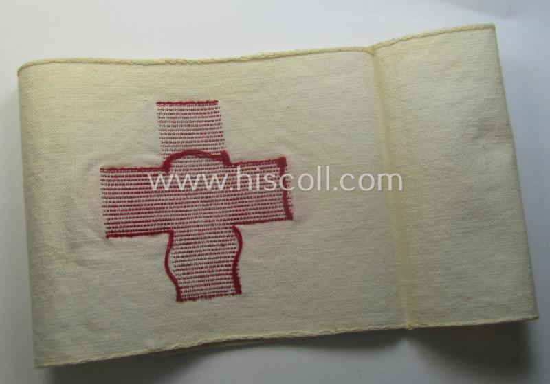 WH (Heeres) related, linnen-based- and/or neatly 'machine-embroidered', beige-white-coloured DRK- (ie. 'Deutsches Rotes Kreuz'-) armband (ie. 'Armbinde') as was intended for the staff-members serving as medical orderly