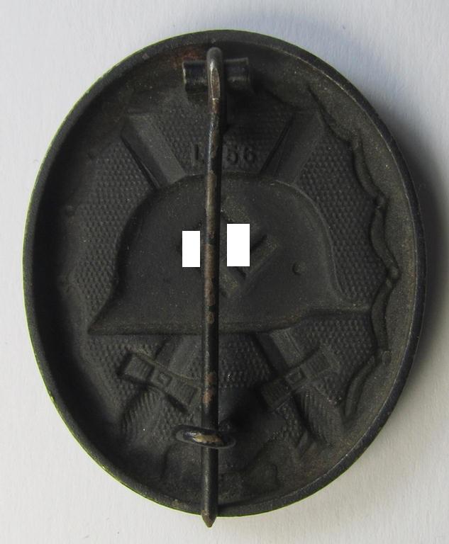 Neatly maker- (ie. 'L/56'-) marked example of a black-class wound-badge (or: 'Verwundeten-Abzeichen in Schwarz') being an example that was produced by the maker (ie. 'Hersteller') named: 'Funcke & Brüninghaus'