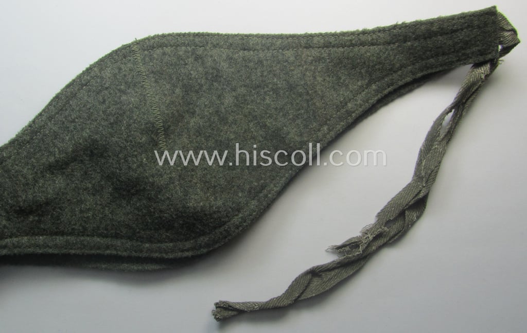 Later-war- (ie. 1943-) pattern, field-grey-coloured, WH (Heeres, Waffen-SS etc.) so-called: 'Ohrenschützer' being intended to be worn in conjunction with the 'M43'-field-caps (ie. 'Einheitsfeldmützen')