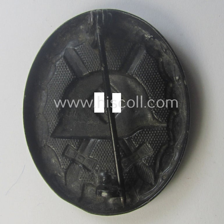 Black-class wound-badge (or: 'Verwundeten-Abzeichen in Schwarz') being a maker- (ie. '4'-) marked specimen as was produced by the maker (ie. 'Hersteller') named: 'Steinhauer & Lück'