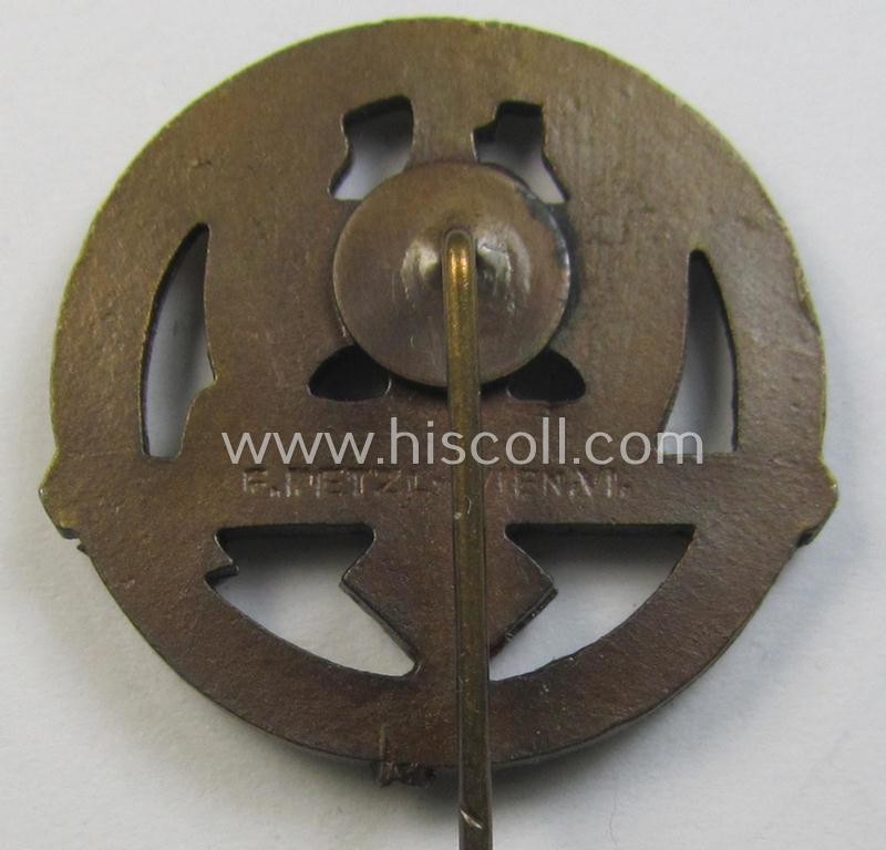 Superb - and rarely found! - Austrian-related, golden-bronze-toned: 'Nationalsozialistischer Soldatenring'- (ie. NSR-) lapel-pin (ie. 'Mitgliedsabzeichen') depicting an eagle-device and text: 'Waffenträger des Volkes 1933-1938'