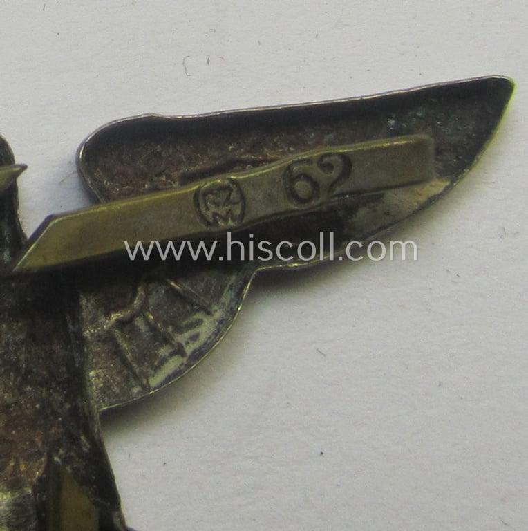 Silver-toned - and 'Buntmetall'-based - early-pattern, SS- o. SA-type, political visor- (ie. 'Schirmmützen'-) cap- (ie. 'Kepi'-) eagle being a (triple!) maker- (ie. 'RzM 62'-) marked example that comes in a used- ie. carefully cap-removed, condition