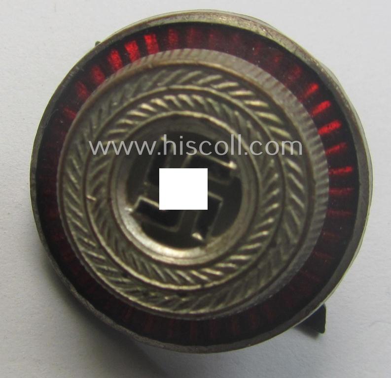 Political-style- (ie. N.S.D.A.P.-related-) multi-pieced visor- (ie. 'Schirmmützen'-) cap-cocarde which is neatly: 'RzM' and/or 'M1/34' marked on its back