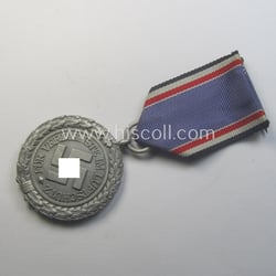 'Luftschutz-Ehrenzeichen 2. Stufe' being a non-maker-marked example as...