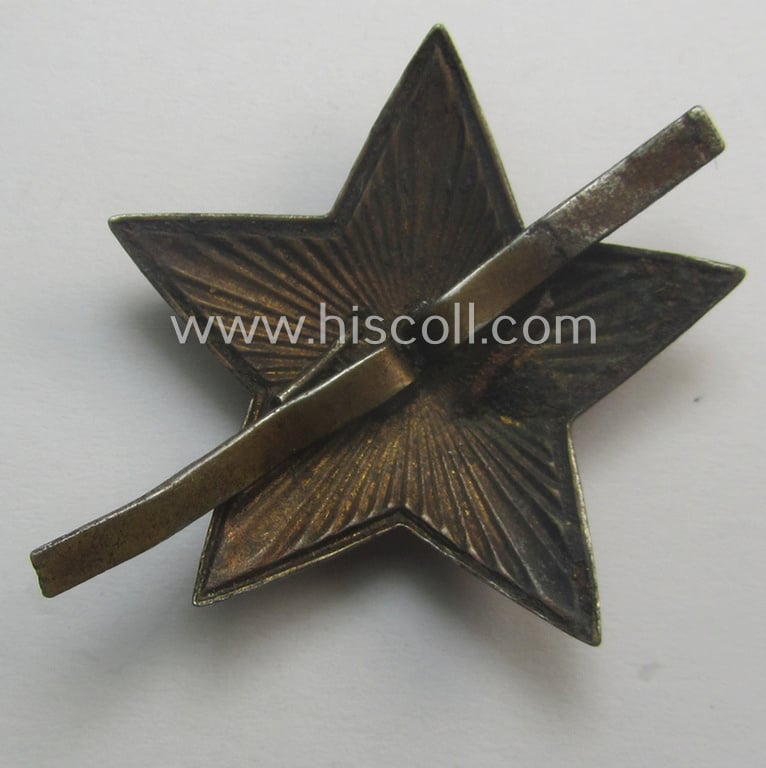 Unusual item that originated from a German soldier: a Russian, larger-sized and/or WWII-period, enamelled star-shaped cap-badge showing the communist logo on a bright-red-coloured surface