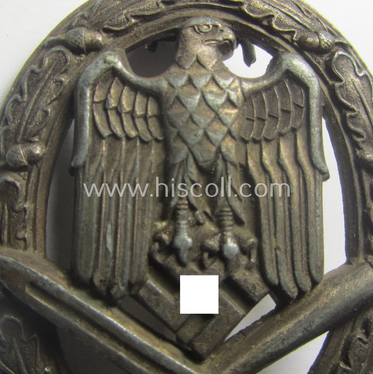 'Allgemeines Sturmabzeichen' (or: General Assault Badge ie. GAB) being a typical unmarked, zinc-based- (ie. 'Feinzink'-) and/or: 'flat-back'-pattern as was (I deem) produced by the: 'Gustav Brehmer'-company