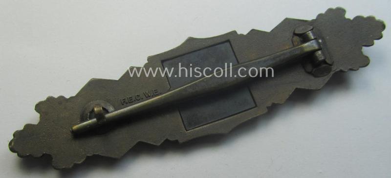 'Nahkampfspange in Bronze' (or: bronze-class close-combat clasp ie. CCC) being a neatly maker-marked- and/or minimally converse-shaped specimen as was produced by the: 'JFS'- (ie. 'Joseph Feix u. Söhne'-) company