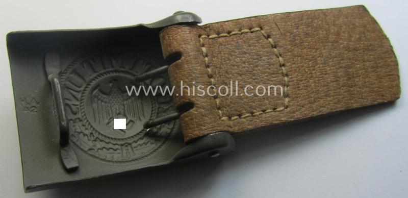 WH (Heeres) 'standard-pattern', field-grey-toned- and steel-based belt-buckle being a maker- (ie. 'H. Arld - Nuernberg'-) marked- and/or: '1942'-dated example that comes mounted onto its leather- (ie. 'pig-skin'-) based tab
