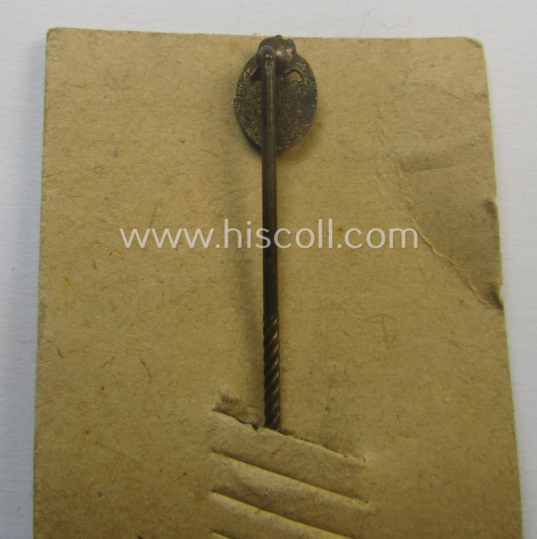 Neat - and only 9 mm. sized! - miniature-lapel-pin depicting a: 'Panzerkampfabzeichen in Bronze' (or: bronze-class panzer-assault-badge ie. PAB) being a non-maker-marked example that comes mounted onto its period 'LDO'-card