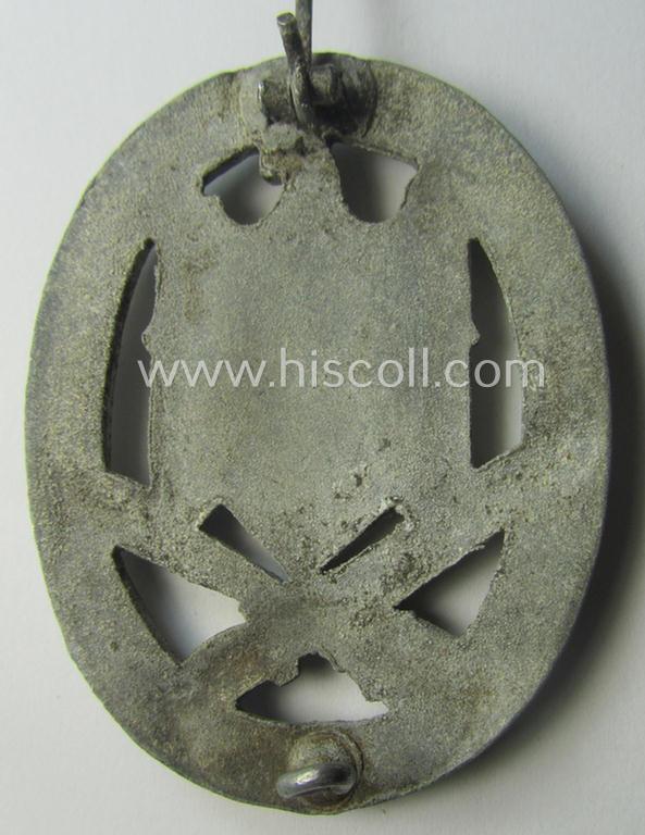 'Allgemeines Sturmabzeichen' (or: General Assault Badge ie. GAB) being a typical unmarked, zinc-based- (ie. 'Feinzink'-) and/or: 'semi-hollow-back'-version as was (I deem) produced by the: 'Rudolf Karneth'-company