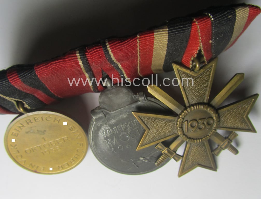 3-pieced WH (Heeres etc.) medal-bar (ie.: 'Ordenspange') showing resp. a: 'KvK II.Kl. mit Schwn.', an: 'Ost'-medal and a Czech 'Anschluss'-medal: '1. Oktober 1938'