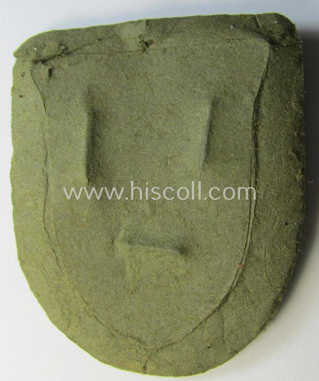 Attractive, WH (Heeres o. Waffen-SS) 'Krim'-campaign-shield that comes mounted onto its original, field-grey-coloured 'backing' and that comes in an issued-, minimally worn and/or (I deem) carefully tunic-removed-, condition