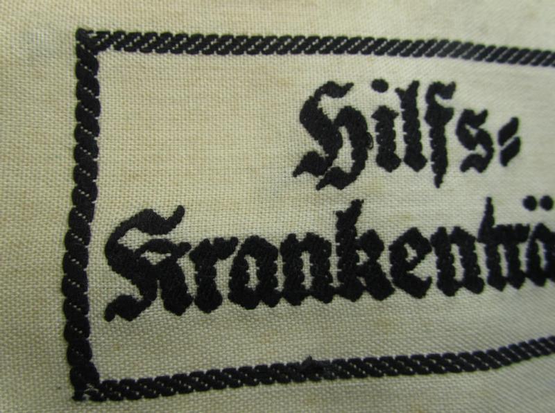 Neat, beige/white-coloured- and/or linnen-based armband (ie. 'Armbinde') as was executed in the 'thicker-styled' fabric as was intended for WH (Heeres) staff-members working as: 'Hilfs-Krankenträger'