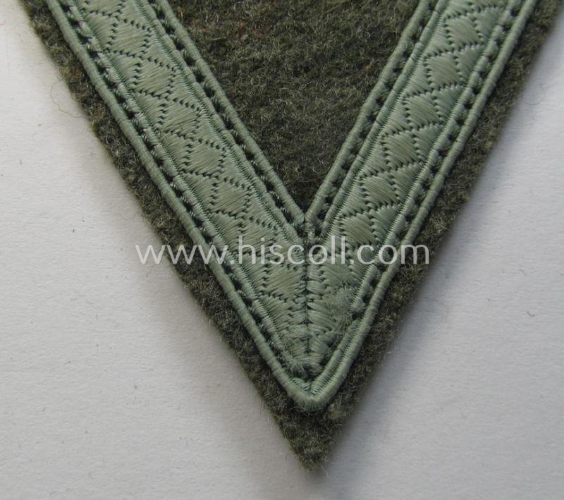 WH (Heeres) 'Armwinkel' (or: arm-chevron) as executed on typical field-grey-coloured wool as was specifically intended for usage by a soldier with the rank of: 'Gefreiter'