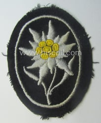 Waffen-SS-pattern, black-coloured sleeve-insignia (ie. 'Ärmelabzeichen') depicting an: 'Edelweiss'-flower...