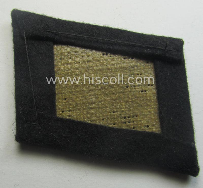 Waffen-SS EM-pattern rank-collar-rank-tab ('Kragenspiegel') being a 'standard-issue'-pattern example as executed in black-coloured wool as was intended for usage by an: 'SS-Mann'