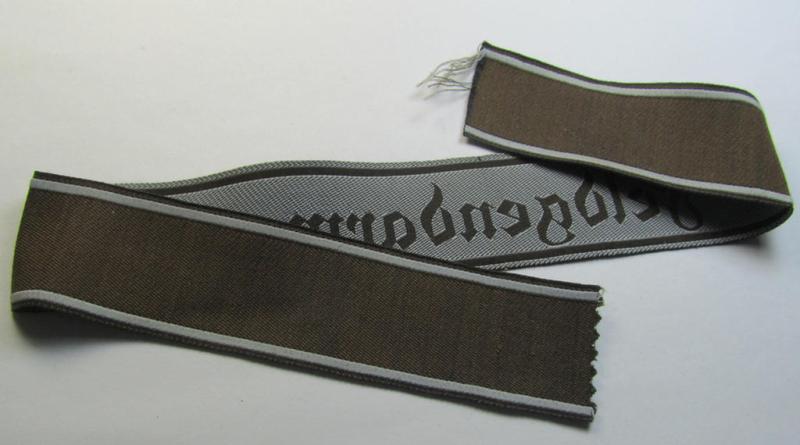 Superb - and scarcely encountered! - example of a WH (Heeres) cuff-title ie. armband (ie. 'Ärmelstreifen') entitled: 'Feldgendarmerie' (being a typical 'semi-BeVo'-woven!) example that comes in a minimally shortened, condition