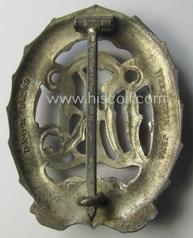 'Reichssportabzeichen DRL in Silber' (or: DRL sports'-badge in silver) being a just moderately worn- ie. used example that is nicely maker- (ie. 'Wernstein - Jena'-) marked on its back
