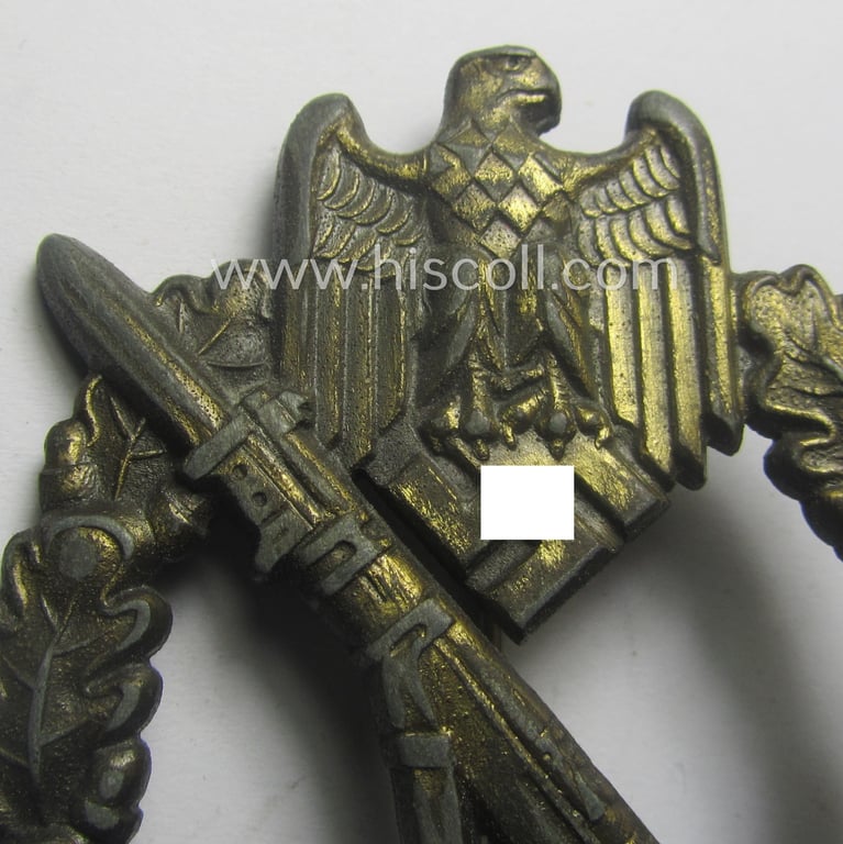 'Infanterie Sturmabzeichen in Bronze' being a maker- (ie. 'JFS'-) marked, 'solid-back' example by the desirable maker: 'Josef Feix u. Söhne' as was executed in golden-bronze-coloured, zinc-based metal