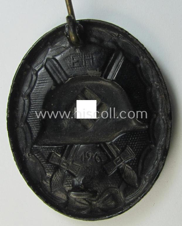 Neat, dual-maker- (ie. 'E.H.'- and/or: '126'-) marked example of a black-class wound-badge (or: 'Verwundeten-Abzeichen in Schwarz') being an example that was produced by the maker (ie. 'Hersteller') named: 'Eduard Hahn'