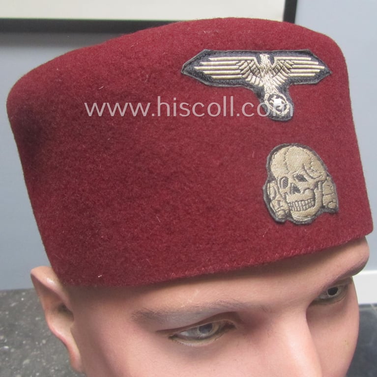 Superb, maroon-red-coloured, Waffen-SS-pattern so-called: 'Fez' having a neat - and fully matching! - silver-grey-coloured- and/or 'BeVo'-woven insignia-set originally- (ie. 'off-factory'-) attached