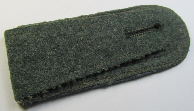 Single, mid-war-period, so-called: 'M43'-pattern, WH (Heeres) NCO-type shoulderstrap as piped in the light-blue-coloured branchcolour as was intended for usage by an: 'Uffz. der Nachschub-Truppen'