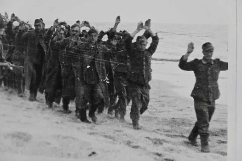 US WW2 Press Photo 'Prisoners of War on the Normandy Beach'