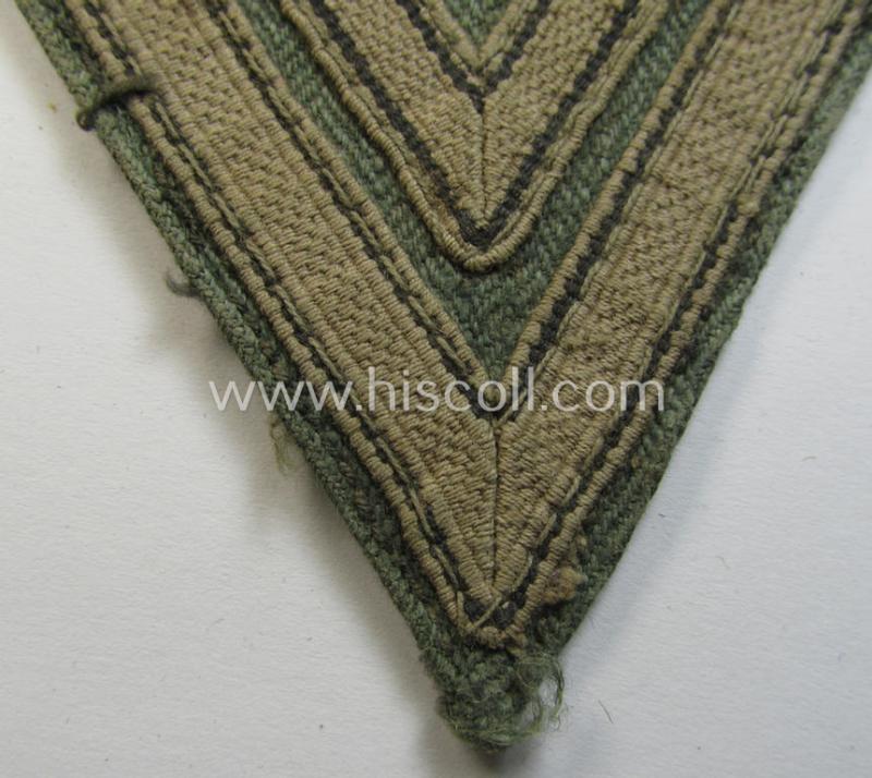 Truly used WH (Heeres ie. Waffen-SS) 'Armwinkel' (or: arm-chevron) as was executed on a greenish-coloured- and/or 'HBT'-like (ie. 'Drillich'-) based background as was specifically intended for usage by an: 'Obergefreiter' (ie. 'SS-Rottenführ...