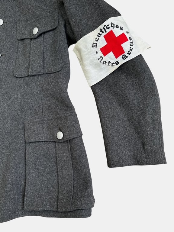 DRK (Deutsches Rotes Kreuz)  Vorhelfer service tunic with original insignia and armband.